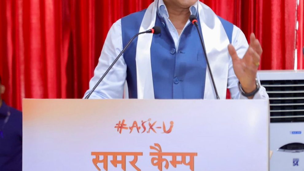 Sports Minister Col. Rajyavardhan Rathore addressing a gathering of young rural athletes, explaining the importance of mental conditioning and soft skills.