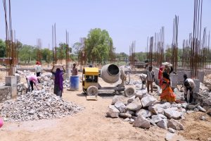 Cabinet Minister Col. Rajyavardhan Singh Rathore conducting an on-site progress inspection of the upcoming 100-bed Jhotwara Satellite Hospital building.