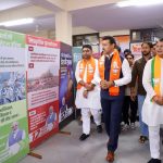 BJP Minister Col. Rajyavardhan Singh Rathore interacting with first-time young tech entrepreneurs and reviewing prototype layouts at a Jaipur startup meet.