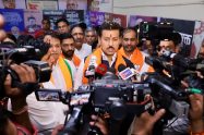 First-time young entrepreneurs showcasing an innovative tech product prototype to Cabinet Minister Col. Rajyavardhan Singh Rathore at a Jaipur startup meet.